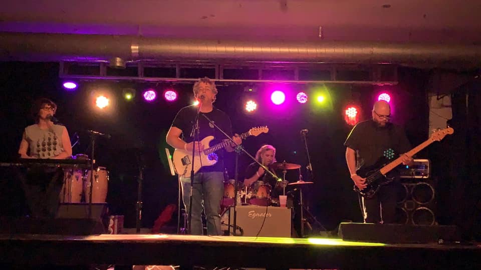 The band performing on stage