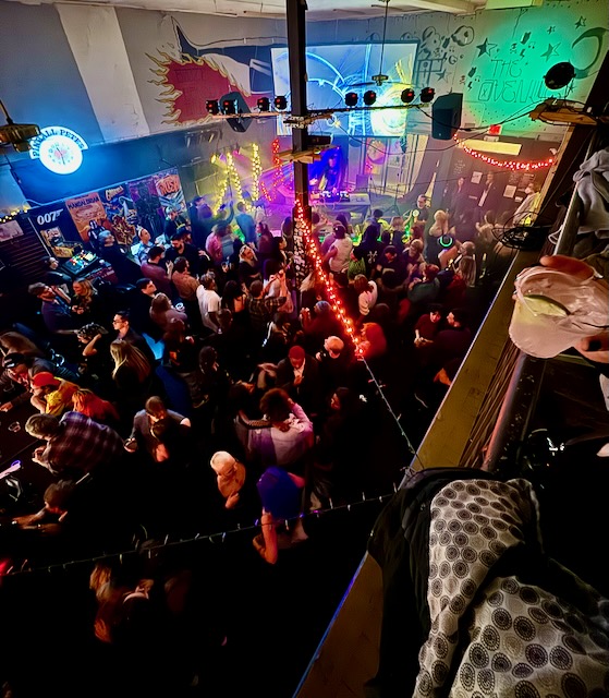 A Dj performs on stage at the avenue