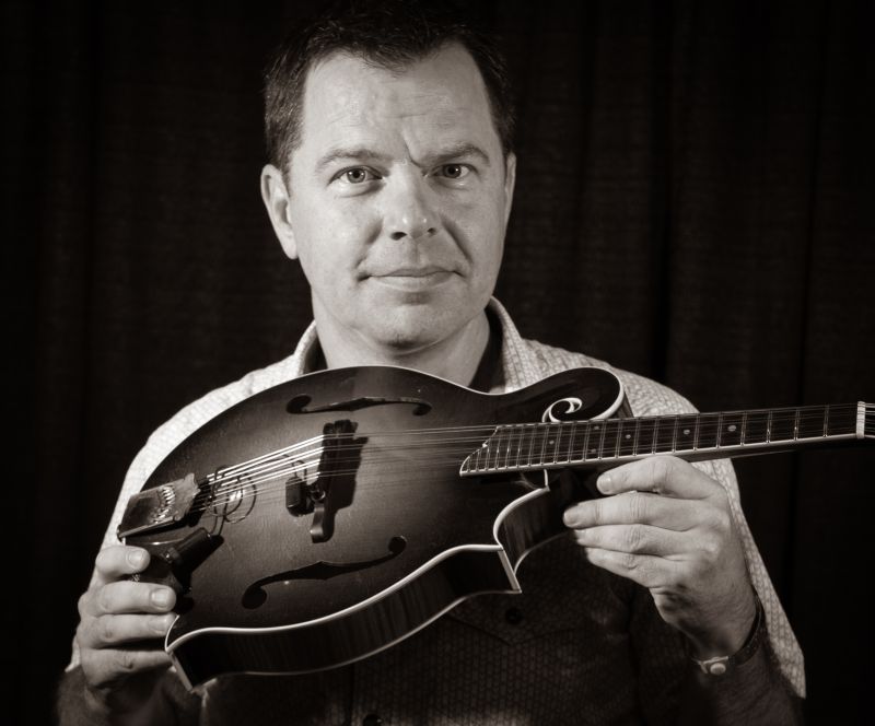 Oberlin is pictured holding his mandolin.