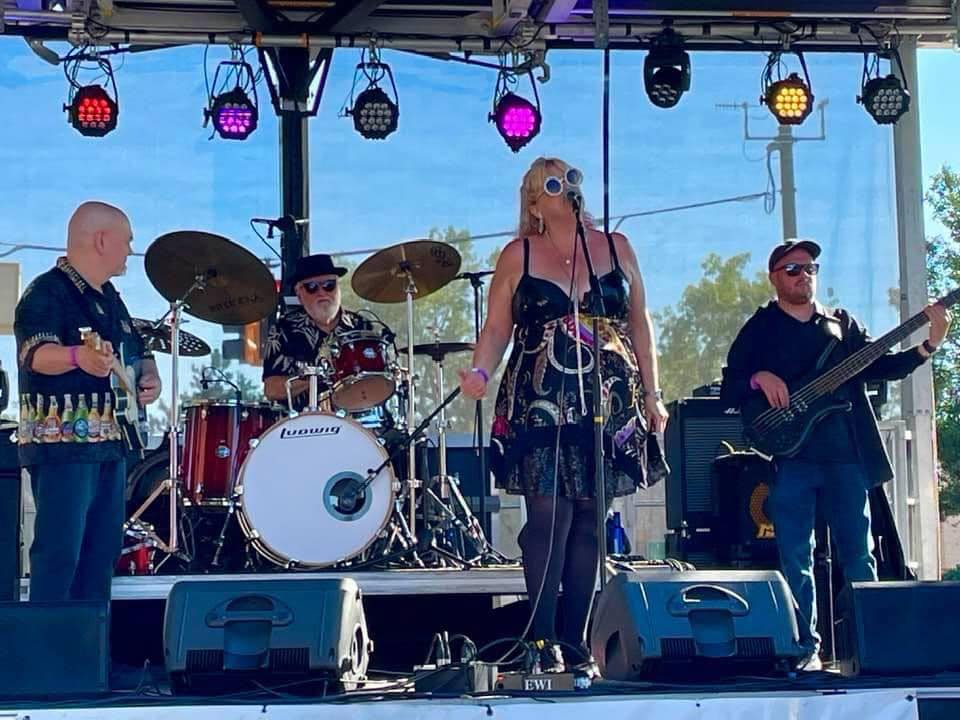 Garner performs on stage with the band.